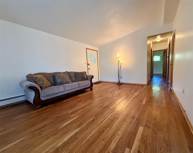 123 Helene Rd, Valley Cottage, NY 10989 - living area featuring wood finished floors, a baseboard heating unit, and baseboards