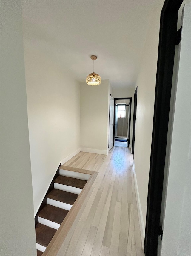 69-14 198th St, Fresh Meadows, NY 11365 - hallway with light wood-style flooring, baseboards, and stairs