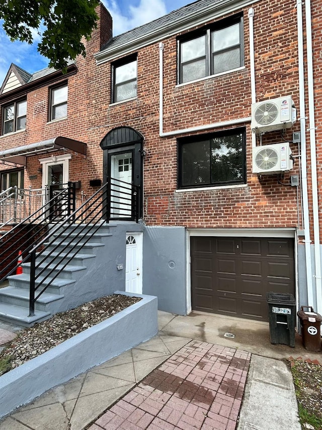 69-14 198th St, Fresh Meadows, NY 11365 - multi unit property with brick siding, a garage, and a cooling unit