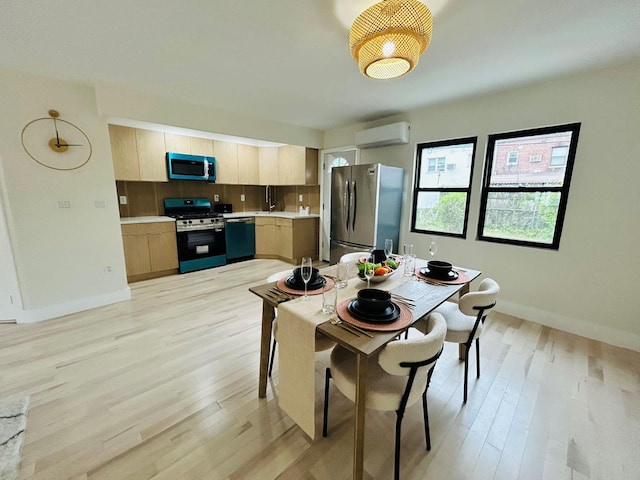 69-14 198th St, Fresh Meadows, NY 11365 - dining area with an AC wall unit, light wood finished floors, and baseboards