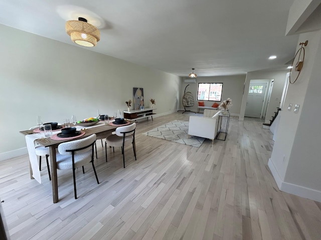69-14 198th St, Fresh Meadows, NY 11365 - dining room featuring baseboards, light wood-style flooring, recessed lighting, and stairway