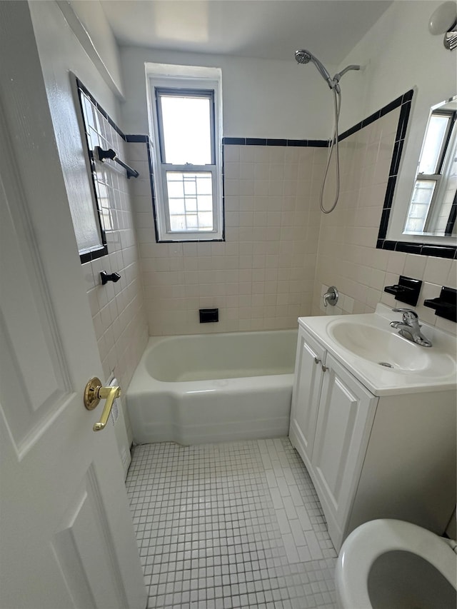 610 Waring Ave Unit 5G, Bronx, NY 10467 - full bathroom featuring washtub / shower combination, tile patterned flooring, vanity, tile walls, and toilet