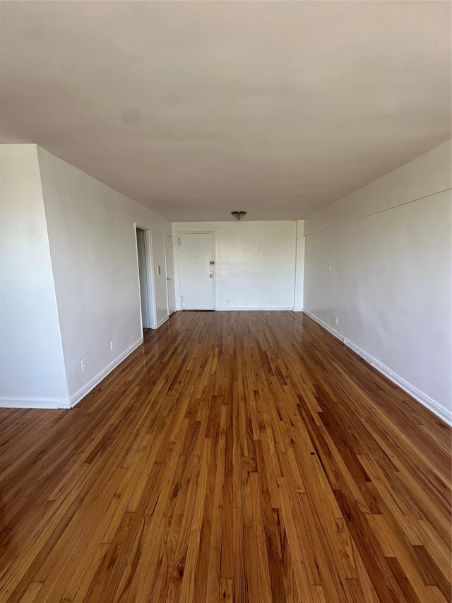 610 Waring Ave Unit 5G, Bronx, NY 10467 - spare room featuring dark wood-style flooring and baseboards