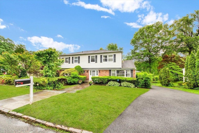 13 Romar Ave, White Plains, NY 10605 - colonial home with a front lawn and brick siding