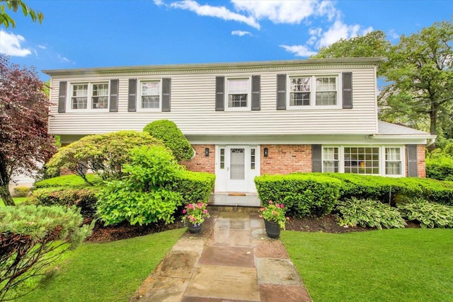 13 Romar Ave, White Plains, NY 10605 - colonial inspired home with a front yard and brick siding