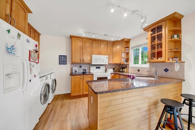 13 Romar Ave, White Plains, NY 10605 - kitchen with white appliances, open shelves, independent washer and dryer, a sink, and dark stone counters