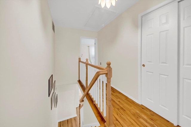 13 Romar Ave, White Plains, NY 10605 - hall with an upstairs landing, attic access, light wood finished floors, and baseboards