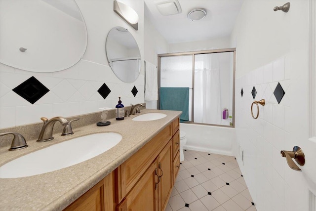 13 Romar Ave, White Plains, NY 10605 - full bathroom featuring double vanity, combined bath / shower with glass door, toilet, and tile patterned floors