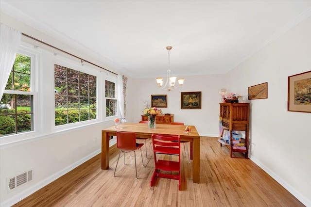 13 Romar Ave, White Plains, NY 10605 - dining space featuring a chandelier, baseboards, light wood finished floors, and ornamental molding