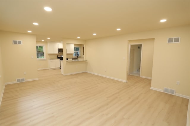 20 Pineview Rd, West Nyack, NY 10994 - unfurnished living room with recessed lighting and light wood-type flooring
