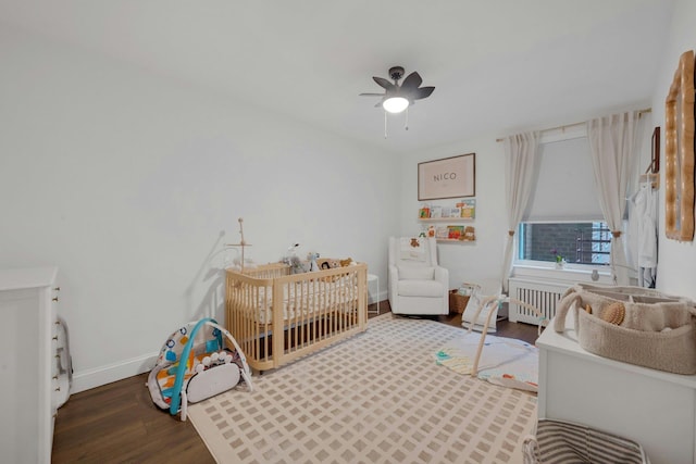1 Vincent Rd Unit 2B, Bronxville, NY 10708 - bedroom with wood finished floors, a crib, baseboards, and a ceiling fan