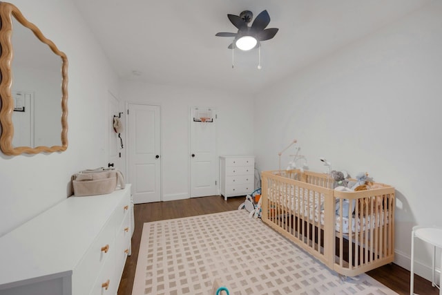 1 Vincent Rd Unit 2B, Bronxville, NY 10708 - bedroom featuring dark wood finished floors, a nursery area, and a ceiling fan