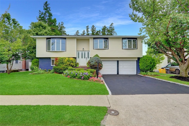 89 Main Pkwy E, Plainview, NY 11803 - split foyer home featuring driveway, an attached garage, a front yard, and brick siding