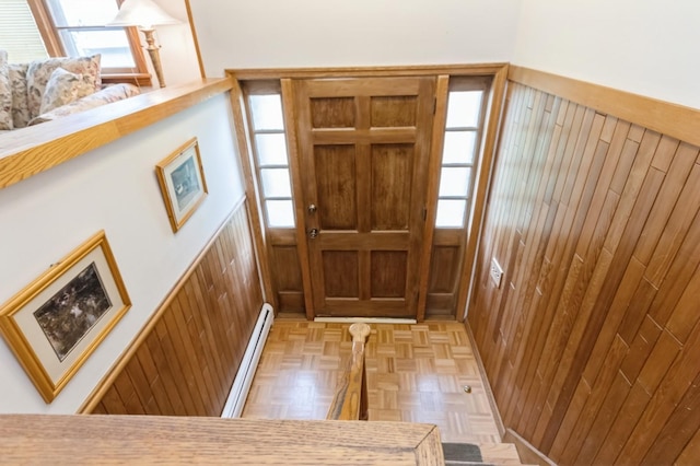 18 Norwood Pl, Nanuet, NY 10954 - foyer featuring baseboard heating, wooden walls, and healthy amount of natural light