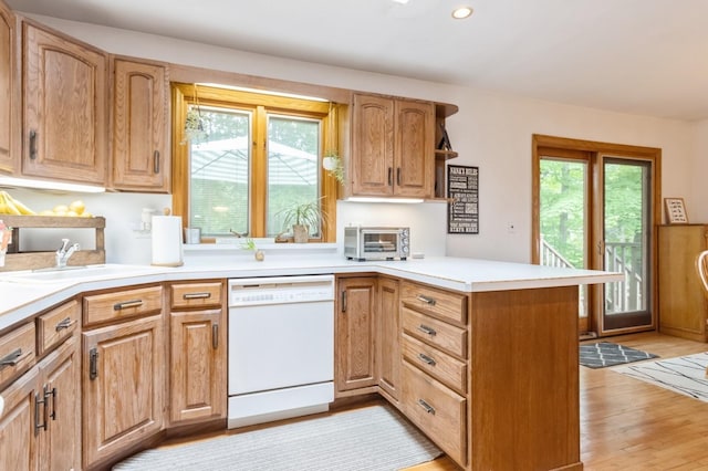 18 Norwood Pl, Nanuet, NY 10954 - kitchen with dishwasher, a peninsula, a sink, light countertops, and recessed lighting