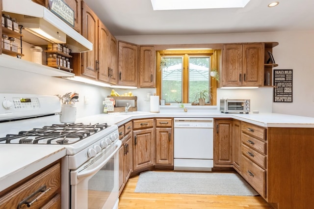 18 Norwood Pl, Nanuet, NY 10954 - kitchen with white appliances, open shelves, a skylight, light wood-style floors, and recessed lighting