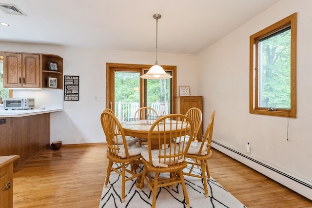 18 Norwood Pl, Nanuet, NY 10954 - dining space featuring a baseboard heating unit, light wood finished floors, baseboards, and recessed lighting