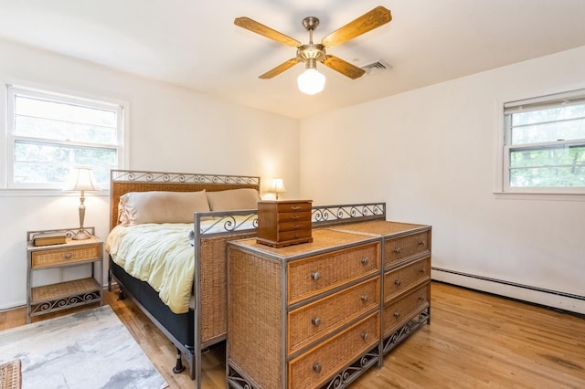 18 Norwood Pl, Nanuet, NY 10954 - bedroom with a baseboard radiator, light wood-style floors, and a ceiling fan