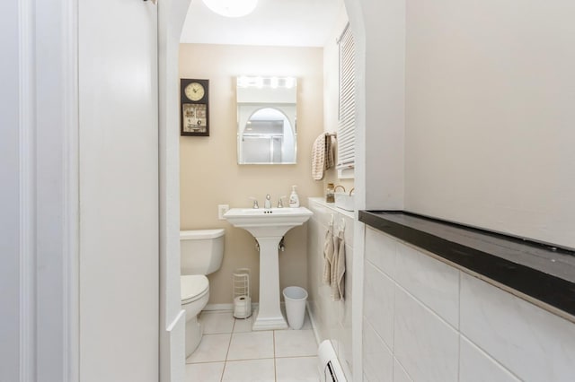 18 Norwood Pl, Nanuet, NY 10954 - half bathroom featuring toilet, tile patterned floors, and a baseboard heating unit