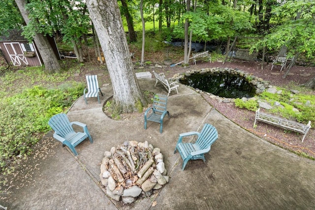 18 Norwood Pl, Nanuet, NY 10954 - view of yard featuring a patio area, a small pond, and a fire pit