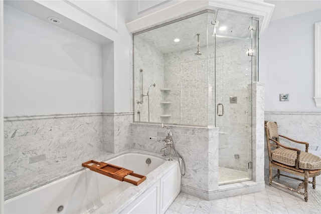 161 Piping Rock Rd, Locust Valley, NY 11560 - bathroom with tile walls, marble finish floors, a marble finish shower, a garden tub, and wainscoting