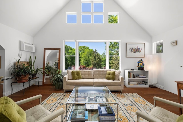 38 Oliphant Ave Unit 6, Dobbs Ferry, NY 10522 - living room with high vaulted ceiling, a wall unit AC, plenty of natural light, and wood finished floors