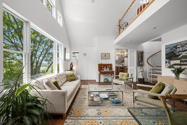 38 Oliphant Ave Unit 6, Dobbs Ferry, NY 10522 - living area with stairway, a towering ceiling, wood finished floors, and a chandelier