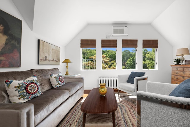 38 Oliphant Ave Unit 6, Dobbs Ferry, NY 10522 - living area with radiator, vaulted ceiling, wood finished floors, and an AC wall unit