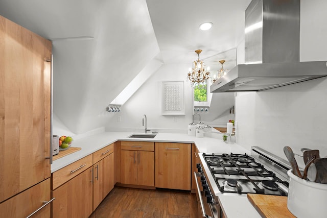 38 Oliphant Ave Unit 6, Dobbs Ferry, NY 10522 - kitchen with wall chimney range hood, gas stove, a sink, light countertops, and dark wood-style flooring