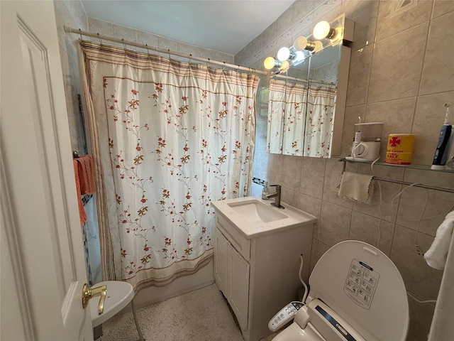 215-19 48th Ave Unit 2C, Bayside, NY 11364 - bathroom with tile walls, toilet, curtained shower, and vanity
