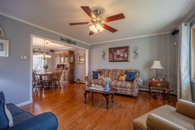 216 Hickory Hill Ln, Newburgh, NY 12550 - living room with a baseboard heating unit, wood finished floors, a ceiling fan, ornamental molding, and baseboards