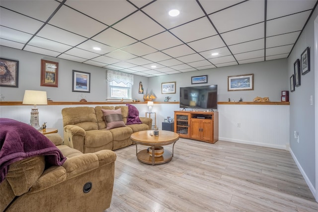 216 Hickory Hill Ln, Newburgh, NY 12550 - living area with light wood-type flooring, baseboards, and a paneled ceiling
