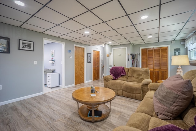 216 Hickory Hill Ln, Newburgh, NY 12550 - living area with wood finished floors, recessed lighting, a paneled ceiling, and baseboards