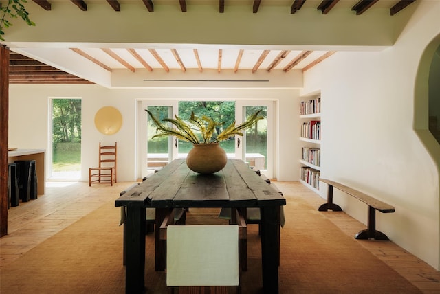 101 Holmes Rd, Newburgh, NY 12550 - dining area featuring beamed ceiling, light colored carpet, and arched walkways