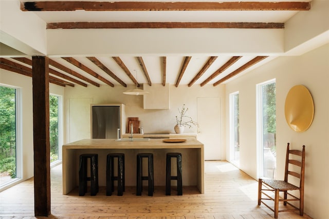 101 Holmes Rd, Newburgh, NY 12550 - kitchen featuring beam ceiling, light wood finished floors, and refrigerator