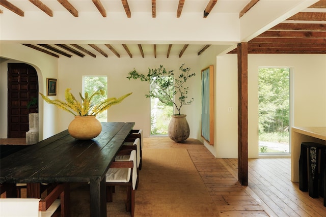 101 Holmes Rd, Newburgh, NY 12550 - dining room featuring beam ceiling, light wood-style flooring, and arched walkways