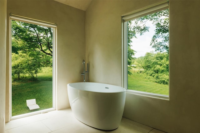 101 Holmes Rd, Newburgh, NY 12550 - full bathroom featuring a freestanding bath, tile patterned flooring, and plenty of natural light