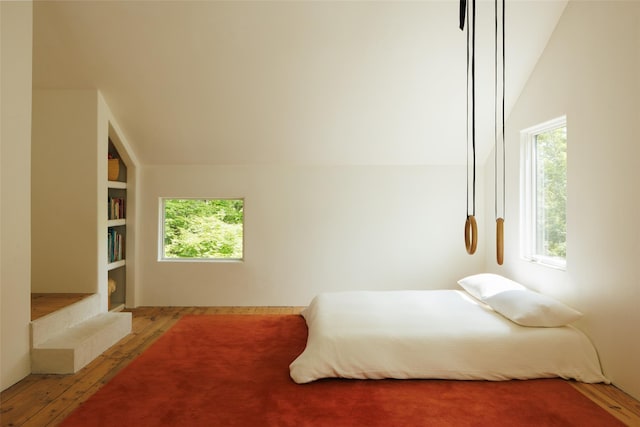 101 Holmes Rd, Newburgh, NY 12550 - bedroom featuring multiple windows, wood-type flooring, and lofted ceiling