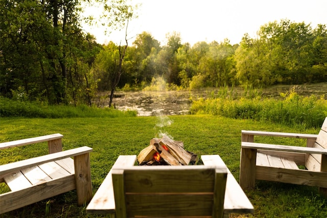 101 Holmes Rd, Newburgh, NY 12550 - view of green lawn featuring an outdoor fire pit, a wooded view, and a water view