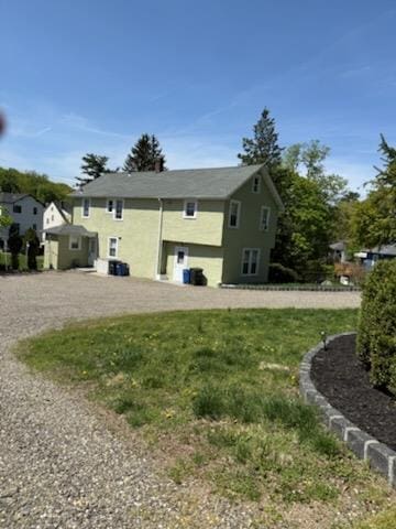 86 E Sunnyside Ln, Irvington, NY 10533 - back of property with stucco siding