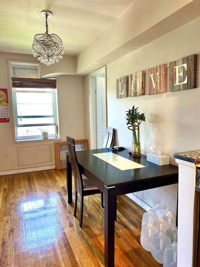 134-54 Maple Ave Unit 3V, Flushing, NY 11355 - dining space with wood finished floors and a chandelier