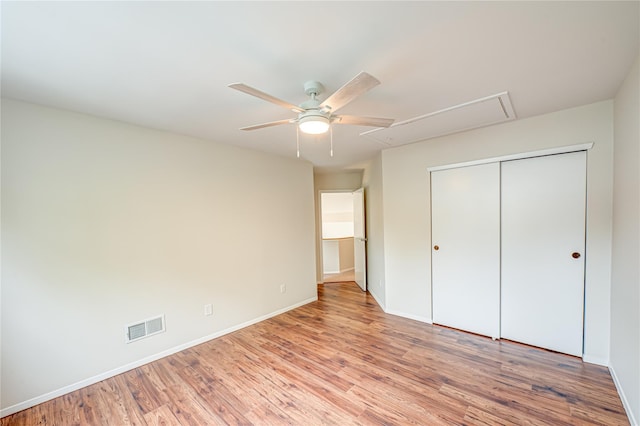 53 Mystic Cir, Bay Shore, NY 11706 - unfurnished bedroom featuring attic access, light wood-style floors, a closet, baseboards, and ceiling fan
