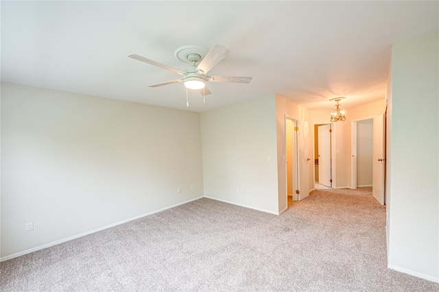 53 Mystic Cir, Bay Shore, NY 11706 - empty room with a chandelier, light carpet, a ceiling fan, and baseboards