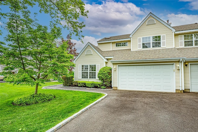 53 Mystic Cir, Bay Shore, NY 11706 - view of front of house featuring driveway, a shingled roof, an attached garage, and a front yard