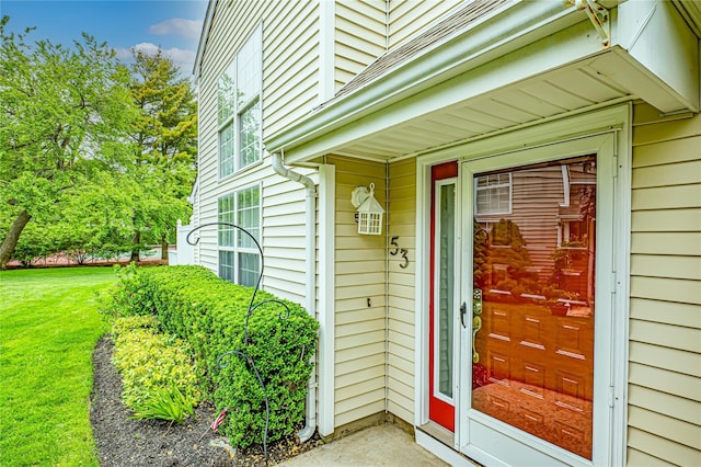 53 Mystic Cir, Bay Shore, NY 11706 - view of exterior entry featuring a yard
