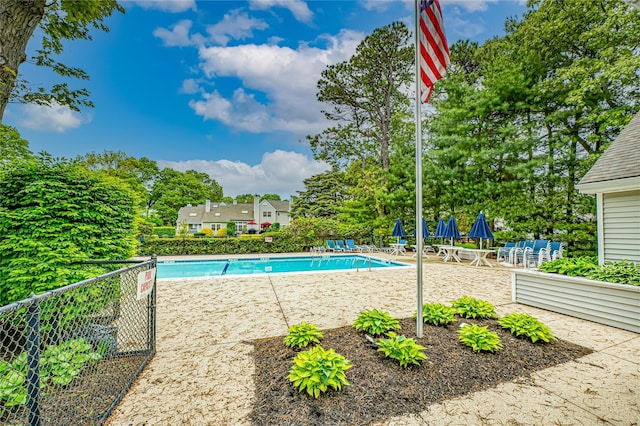 53 Mystic Cir, Bay Shore, NY 11706 - community pool with a patio and view of wooded area