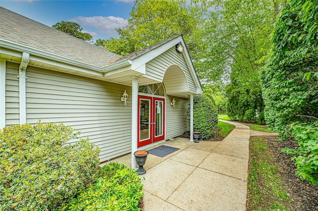 53 Mystic Cir, Bay Shore, NY 11706 - property entrance featuring a shingled roof and french doors