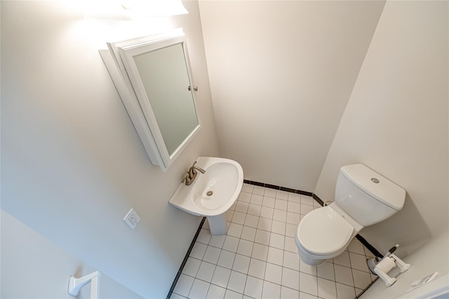 53 Mystic Cir, Bay Shore, NY 11706 - half bathroom featuring toilet, tile patterned floors, a sink, and baseboards