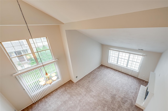 53 Mystic Cir, Bay Shore, NY 11706 - unfurnished living room with carpet floors and lofted ceiling