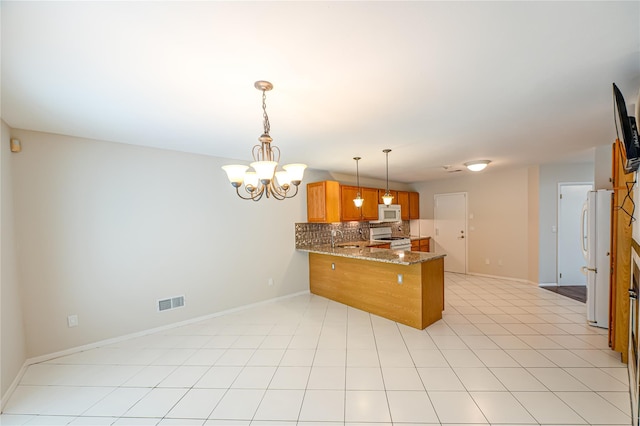 53 Mystic Cir, Bay Shore, NY 11706 - kitchen featuring white appliances, a peninsula, brown cabinets, decorative backsplash, and a chandelier
